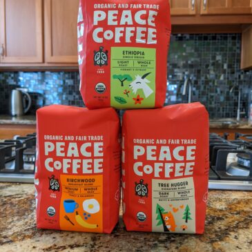3 packs of Peace Coffee on the kitchen table