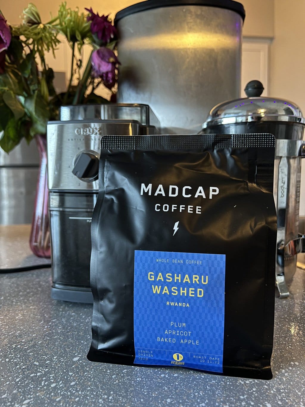 Gasharu Washed - Madcap Coffee pack next to the coffee grinder and french press