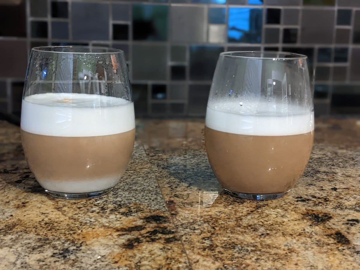 two glasses of coffee with milk foam