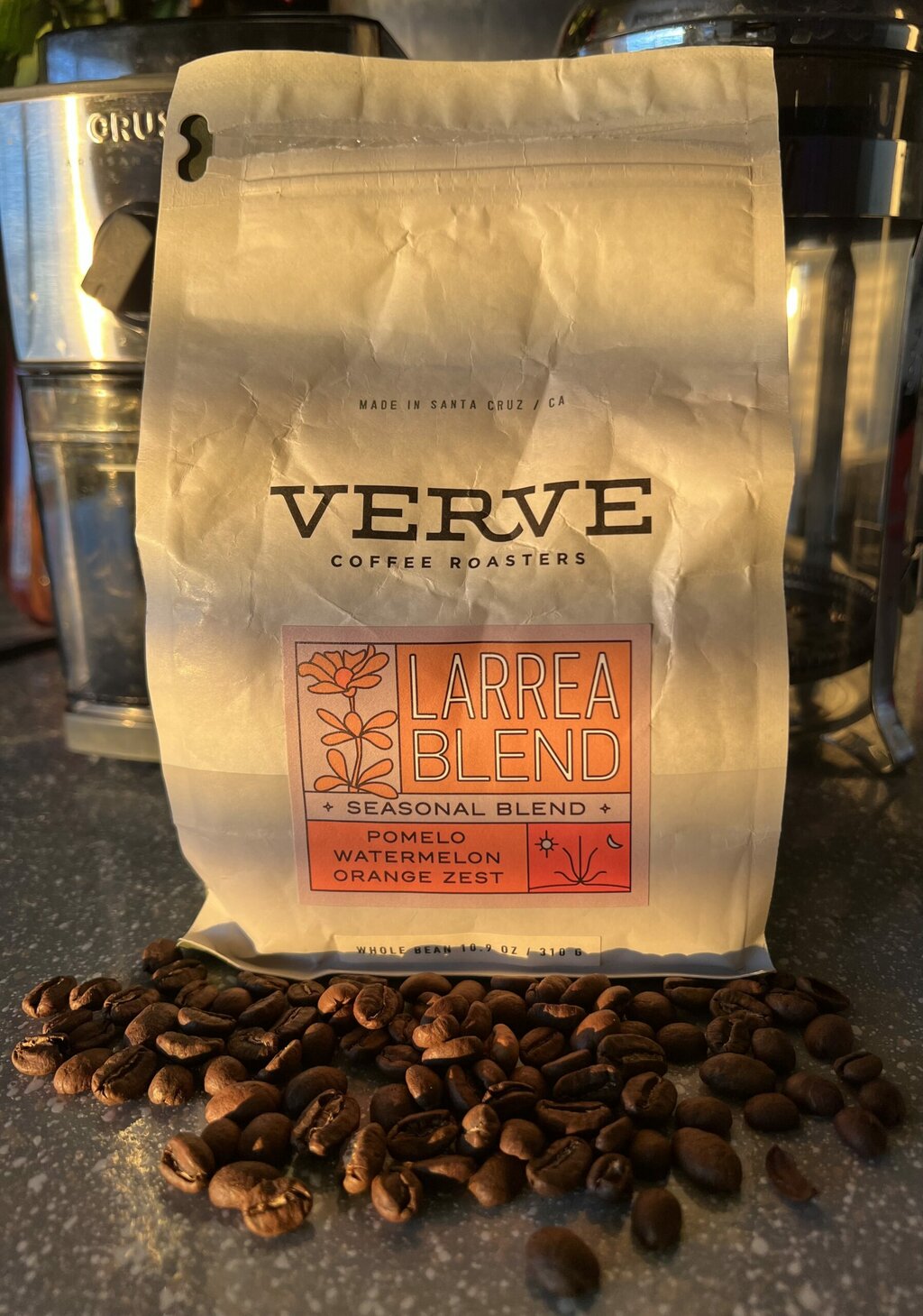 coffee beans scattered in front of Verve Coffee packaging